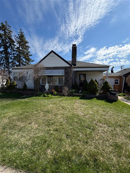Cottage exterior chimney green lawn